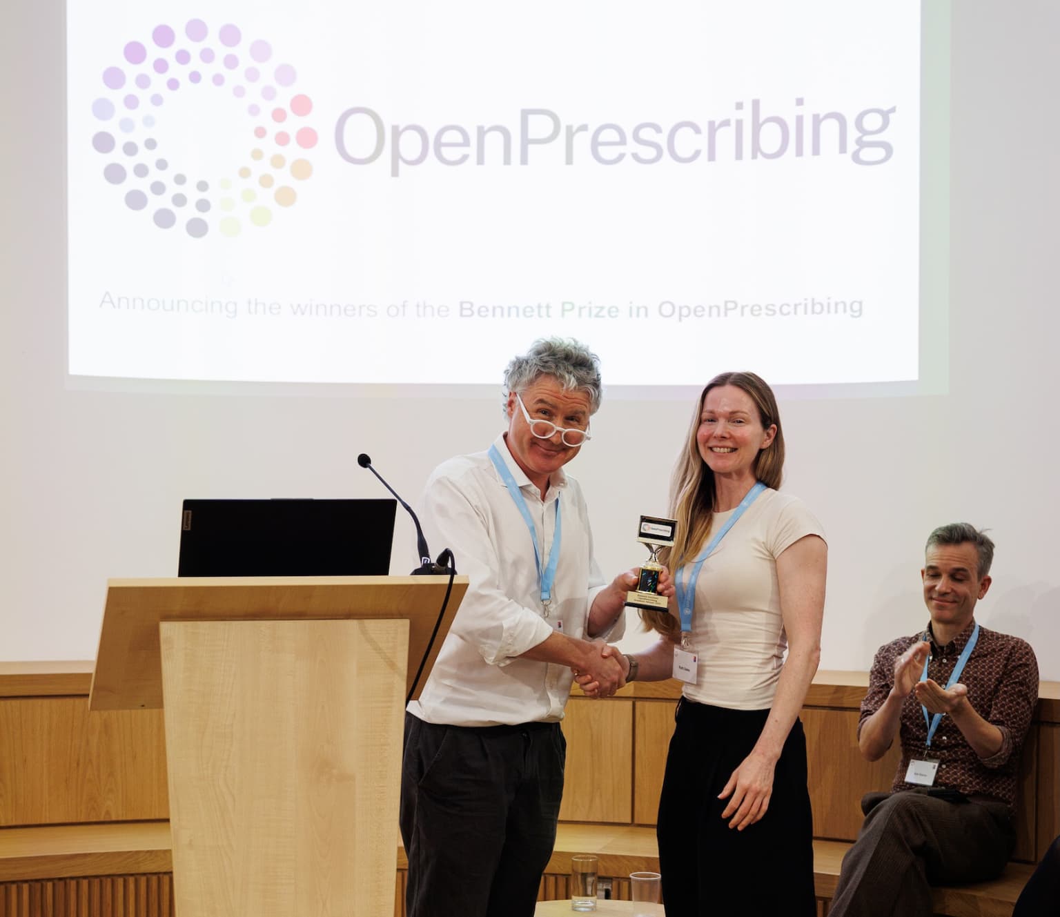 Ben Goldacre presenting a prize to Ruth Dales